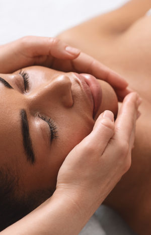 Closeup,Of,Therapist,Hands,Making,Facial,Massage,For,Young,Black