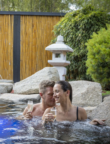 Couple Bathing in Hot Mineral Springs